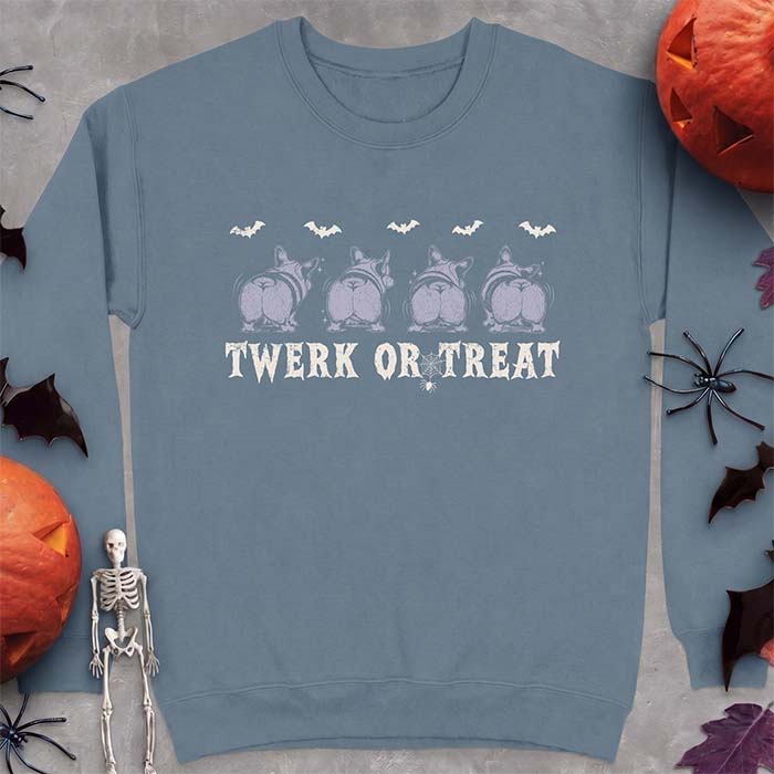 Indigo Blue sweatshirt with a Halloween graphic of four Corgis viewed from behind shaking their rumps, bats flying above and a spider on a web, with the text Twerk Or Treat