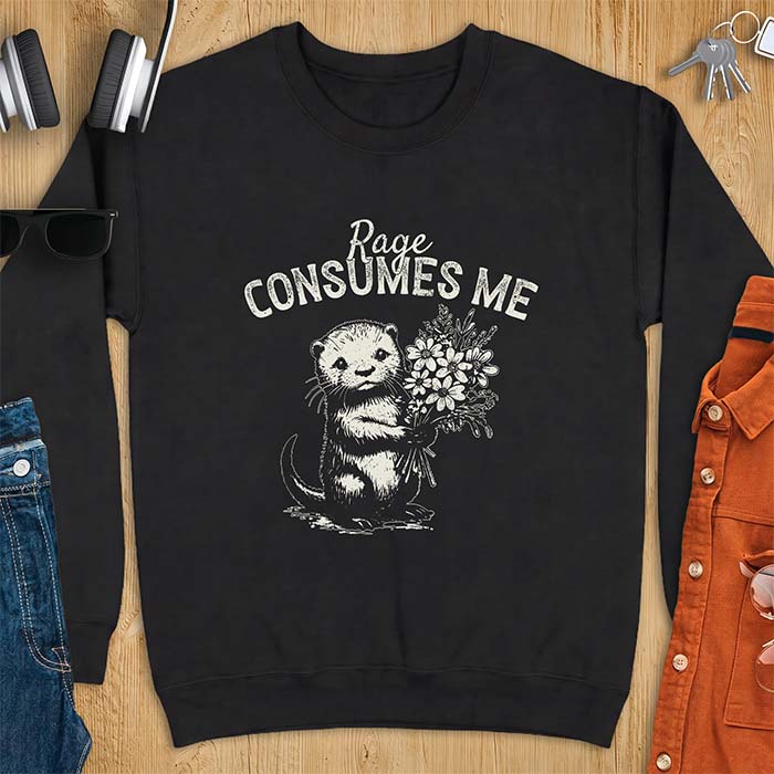 Black sweatshirt with a graphic of an otter standing upright holding a bouquet of wildflowers and the text Rage Consumes Me