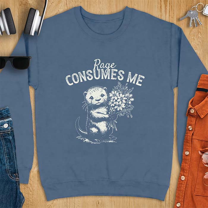 Indigo Blue sweatshirt with a graphic of an otter standing upright holding a bouquet of wildflowers and the text Rage Consumes Me