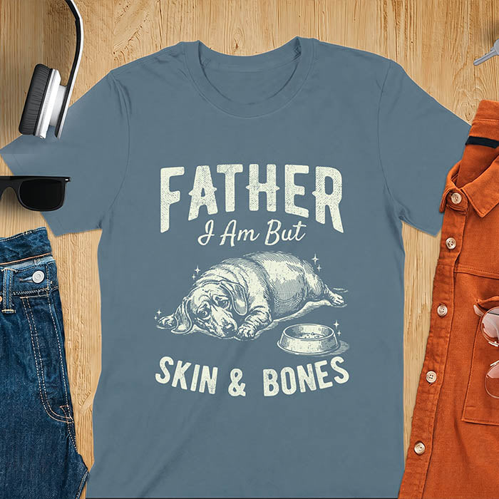 Indigo blue tee with dachshund graphic and bold distressed "Father I Am But Skin & Bones" text