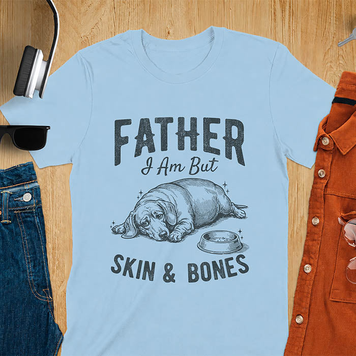 Light blue tee with dachshund graphic and bold distressed "Father I Am But Skin & Bones" text