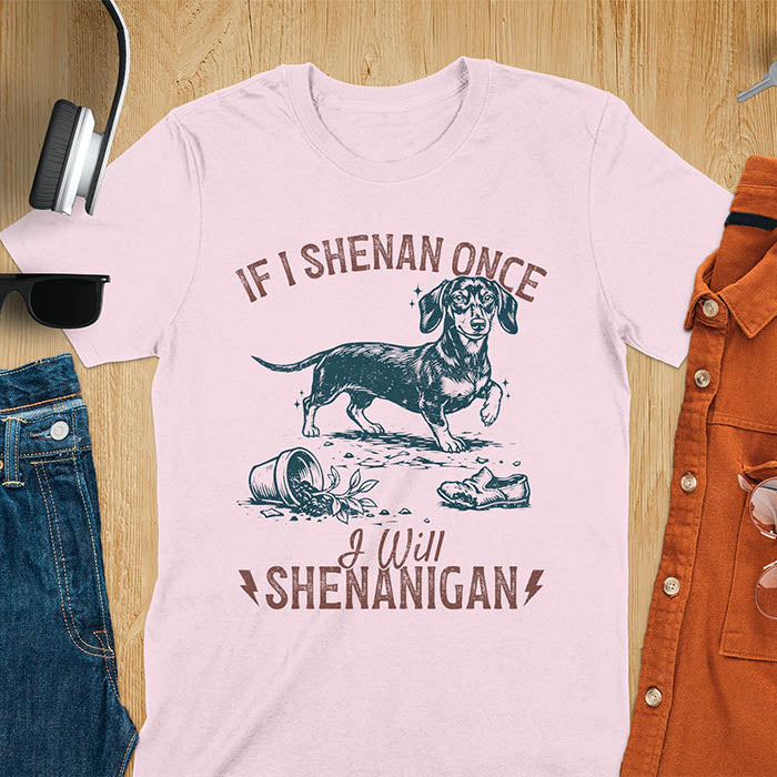 Light pink t-shirt with If I Shenan Once I Will Shenanigan text and Dachshund illustration surrounded by chaos