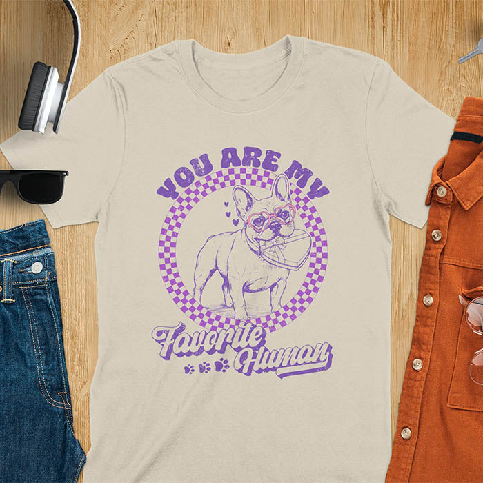 You Are My Favorite Human French Bulldog graphic tee with purple checkered circle design and paw prints on sand color shirt