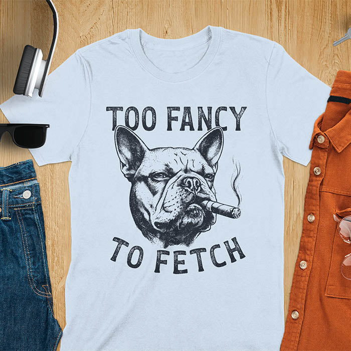 Light blue t-shirt with French Bulldog smoking cigar graphic featuring 'Too Fancy To Fetch' text - vintage grunge dog meme design