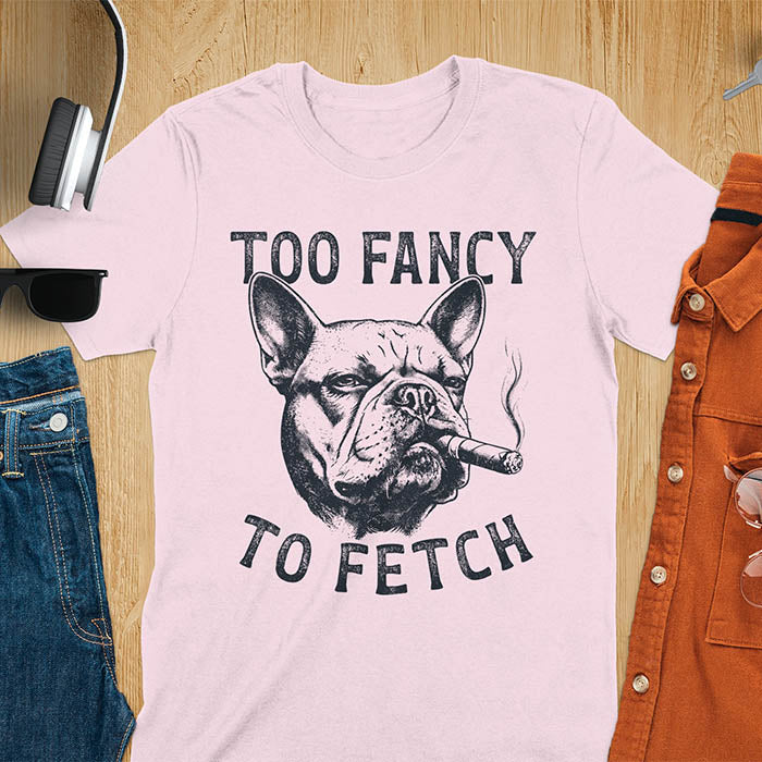 Light pink t-shirt with French Bulldog smoking cigar graphic featuring 'Too Fancy To Fetch' text - vintage grunge dog meme design