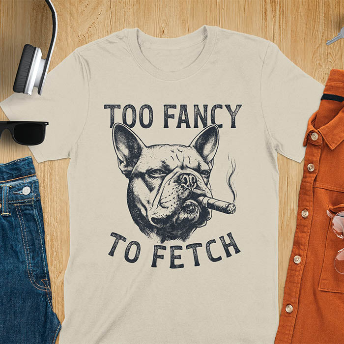 Sand color t-shirt with French Bulldog smoking cigar graphic featuring 'Too Fancy To Fetch' text - vintage grunge dog meme design