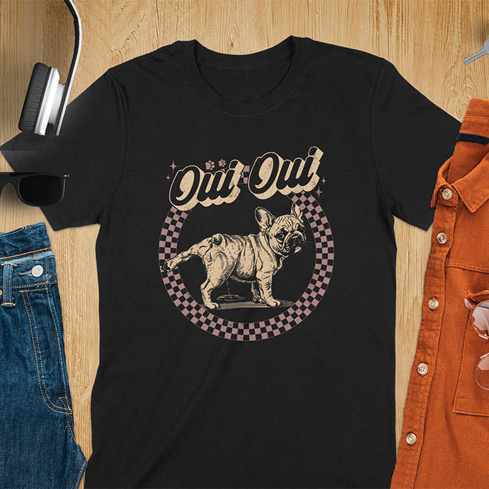 French Bulldog Oui Oui pun t-shirt with checkered circle border and retro script lettering on black tee