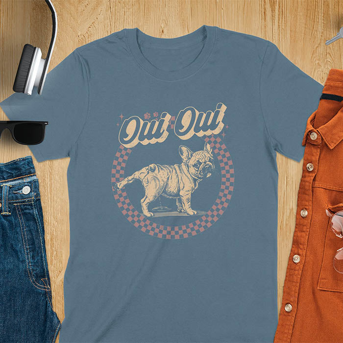 French Bulldog Oui Oui pun t-shirt with checkered circle border and retro script lettering on indigo blue tee