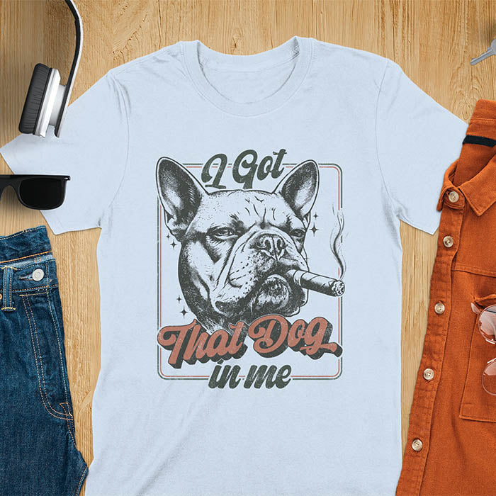 I Got That Dog In Me French Bulldog meme design with cigar smoking Frenchie in vintage retro frame graphic on light blue t-shirt