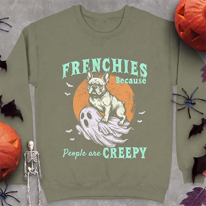 Military Green sweatshirt with a Halloween graphic of a French Bulldog perched on top of a ghost with its own wide-eyed face, a moon and bats behind them and the text Frenchies Because People Are Creepy.