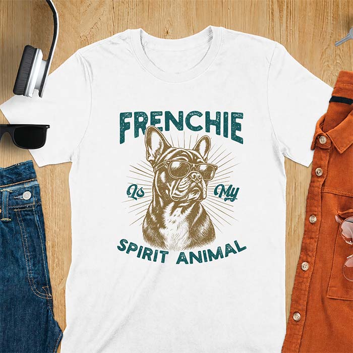 White t-shirt featuring a sunglasses-wearing French Bulldog with sunburst rays behind it and the text Frenchie Is My Spirit Animal.