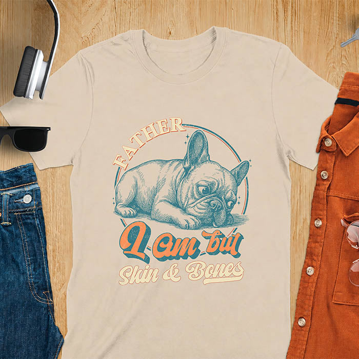 Sand color t-shirt with funny vintage French Bulldog graphic print reading "Father I Am But Skin & Bones" in retro typography