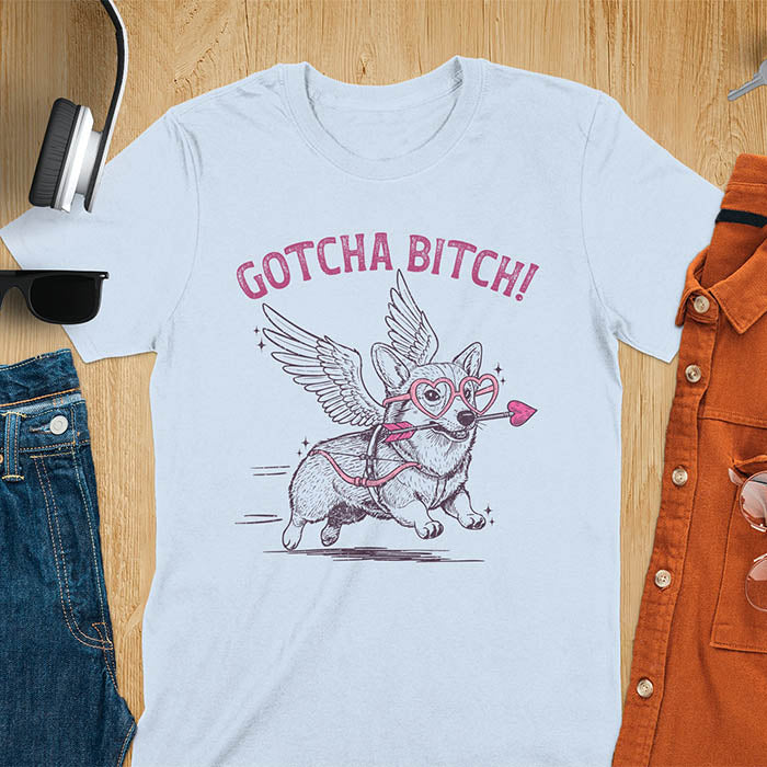 Gotcha Bitch Corgi cupid with angel wings heart glasses and arrow graphic tee on light blue shirt