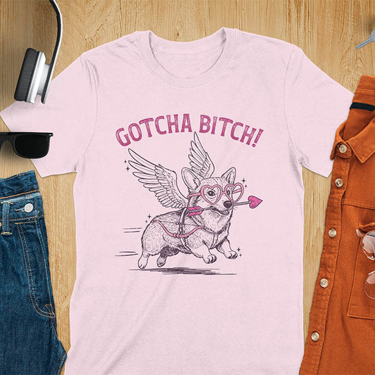 Gotcha Bitch Corgi cupid with angel wings heart glasses and arrow graphic tee on light pink shirt