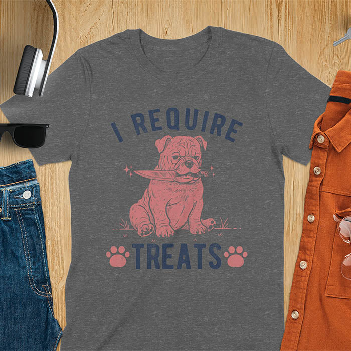 Dark heather tee with "I Require Treats" text and grumpy bulldog puppy holding knife in mouth and paw prints vintage graphic