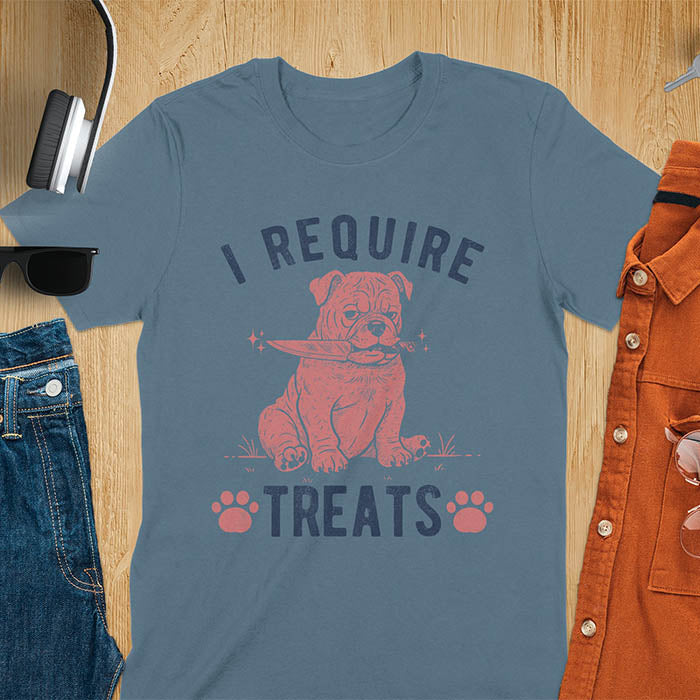 Indigo blue tee with "I Require Treats" text and grumpy bulldog puppy holding knife in mouth and paw prints vintage graphic
