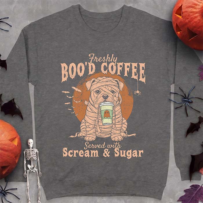 Dark Heather sweatshirt with a Halloween graphic of a bulldog wrapped as a mummy holding a coffee cup, bats and a spider under a moon and the text Freshly Boo'd Coffee served with scream & sugar