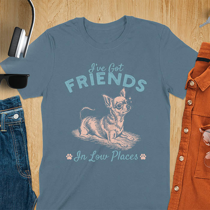 Indigo blue t-shirt featuring a sitting chihuahua illustration with large ears and paw prints, text reads I've Got Friends In Low Places