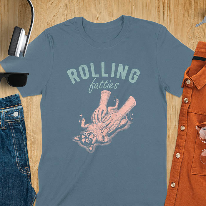 Indigo blue t-shirt featuring chubby chihuahua lying on back getting belly rubs from a pair of hands, text reads Rolling Fatties