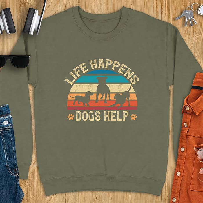 Military Green sweatshirt with a retro striped sunset graphic of three dog silhouettes trotting together and paw prints on either side and the text Life Happens Dogs Help