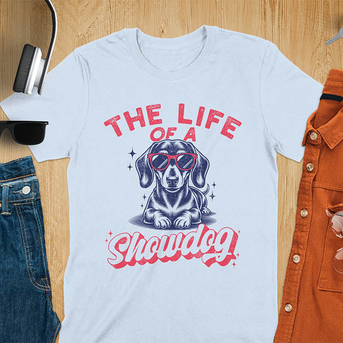 The Life of a Showdog vintage dachshund wearing sunglasses retro t-shirt design on light blue tee