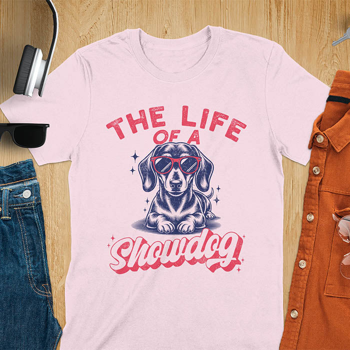 The Life of a Showdog vintage dachshund wearing sunglasses retro t-shirt design on light pink tee