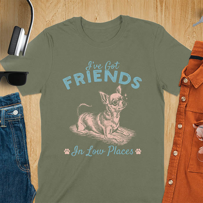Military Green t-shirt featuring a sitting chihuahua illustration with large ears and paw prints, text reads I've Got Friends In Low Places