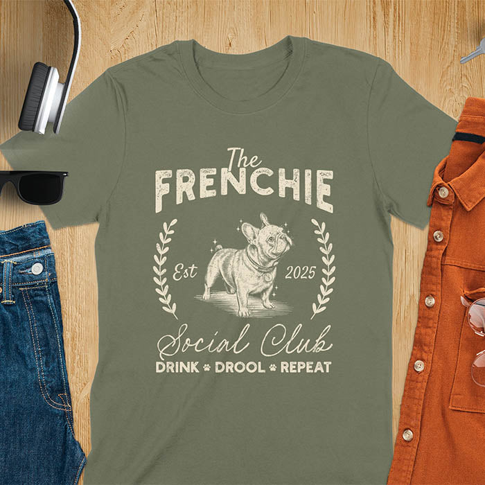 Military Green t-shirt with vintage French Bulldog graphic design featuring 'The FRENCHIE Social Club' text and Frenchie illustration.