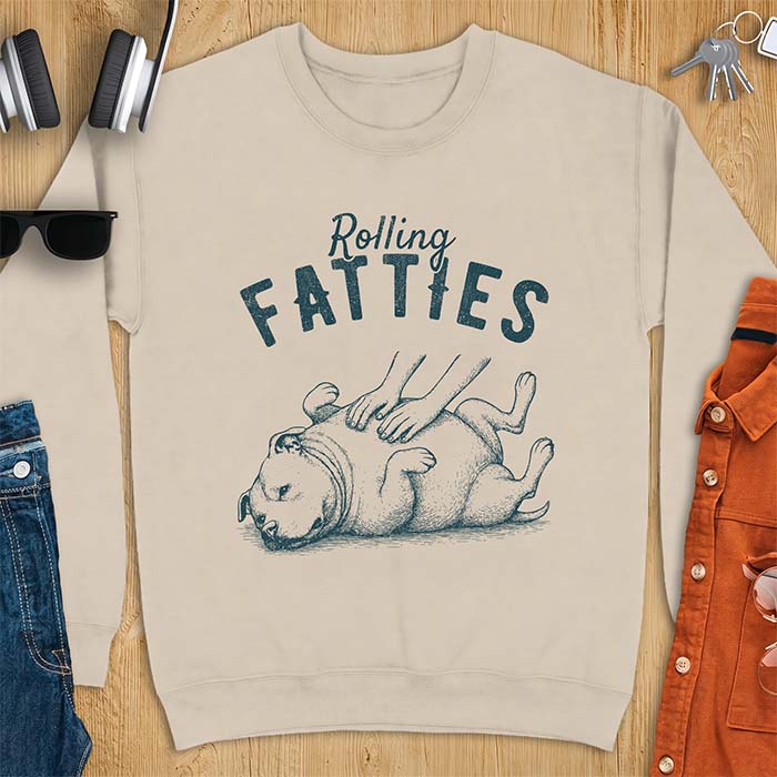 Sand sweatshirt with a vintage illustration of a pitbull rolled onto its back getting a belly rub, with the text Rolling Fatties arched above it
