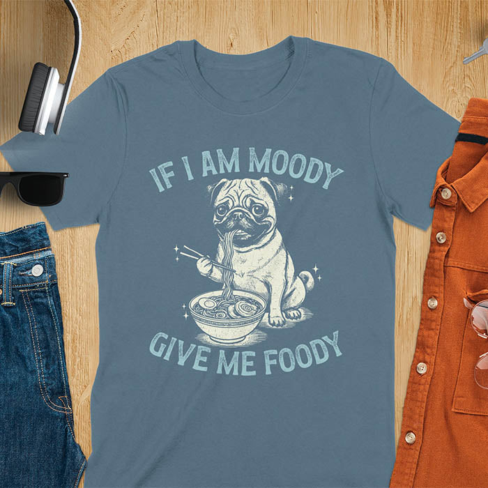 Indigo blue t-shirt with pug eating ramen with chopsticks graphic featuring 'If I Am Moody Give Me Foody' text - funny dog meme design