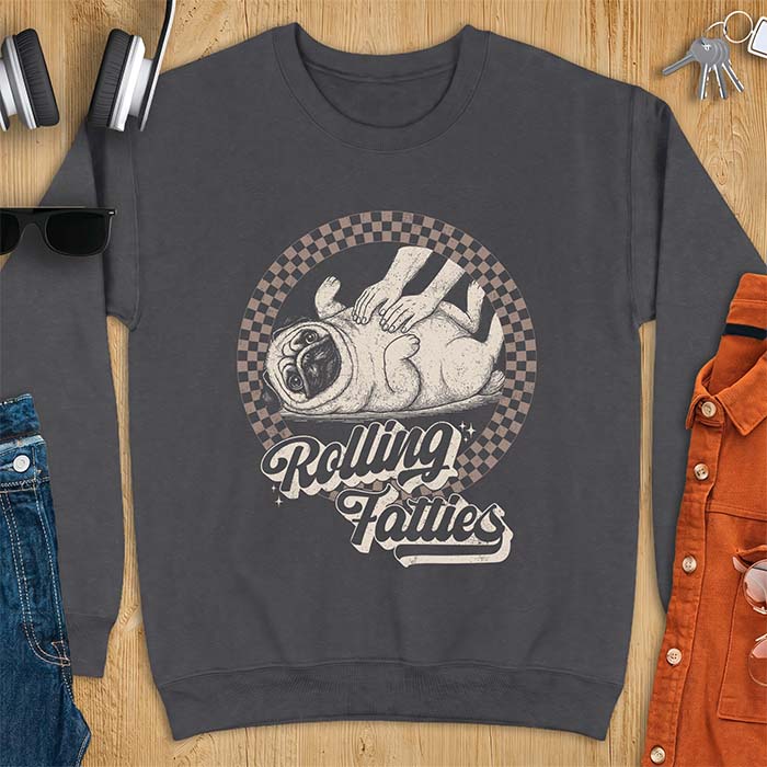 Dark Heather sweatshirt with a graphic of a pug lying on its back inside a checkered circle while a pair of hands press into its rolled folds and the text Rolling Fatties