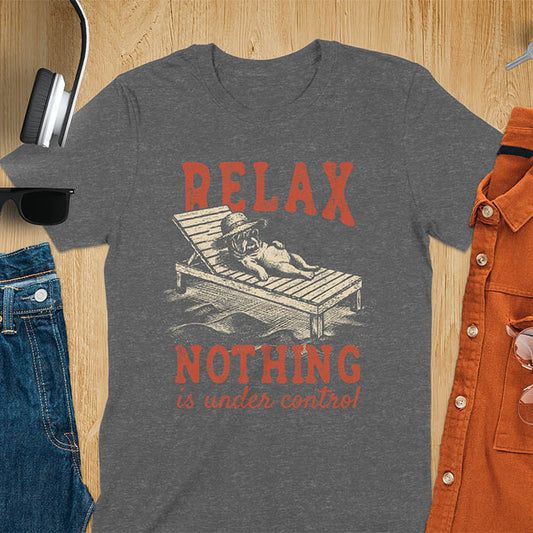 Dark heather t-shirt featuring a bulldog wearing a straw hat lounging on a beach chair with text Relax Nothing Is Under Control in vintage red lettering