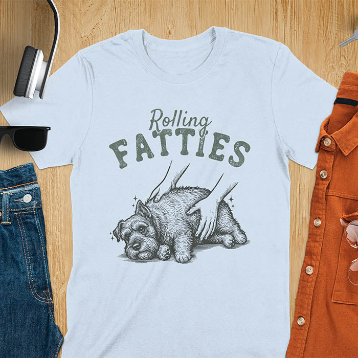Light blue t-shirt with Rolling Fatties text and chubby Schnauzer getting belly rubs illustration