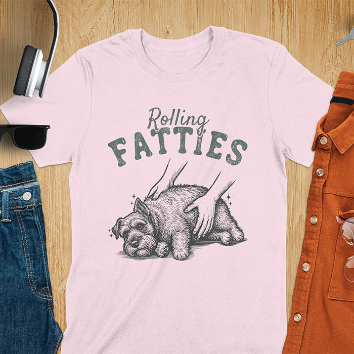 Light pink t-shirt with Rolling Fatties text and chubby Schnauzer getting belly rubs illustration