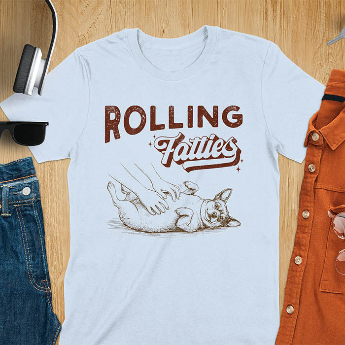 Rolling Fatties vintage text with illustration of chunky terrier lying on back getting belly rubs from human hands