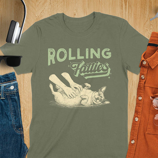 Rolling Fatties vintage text with illustration of chunky terrier lying on back getting belly rubs from human hands