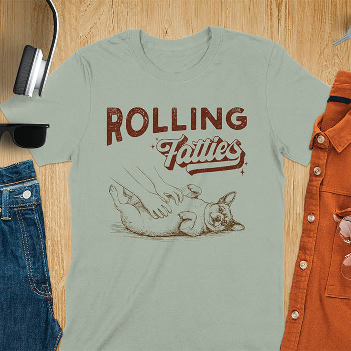 Rolling Fatties vintage text with illustration of chunky terrier lying on back getting belly rubs from human hands