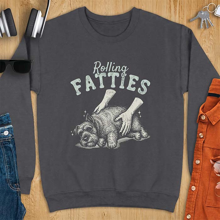 Dark Heather sweatshirt with a graphic of a scruffy Schnauzer lying curled on the ground while two hands reach in to scratch and pet it, plus the text Rolling Fatties above.