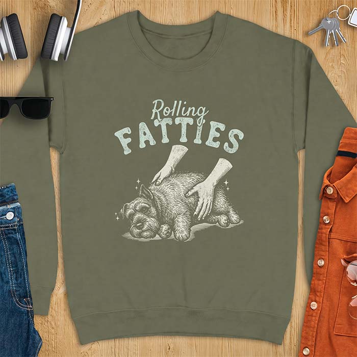 Military Green sweatshirt with a graphic of a scruffy Schnauzer lying curled on the ground while two hands reach in to scratch and pet it, plus the text Rolling Fatties above.