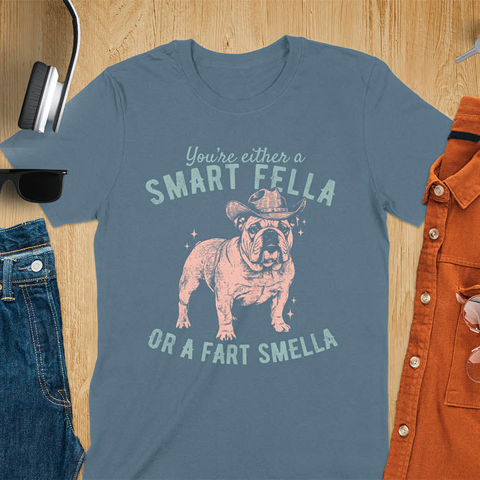 Smart Fella or Fart Smella vintage 90s meme t-shirt with English bulldog wearing cowboy hat on indigo blue tee