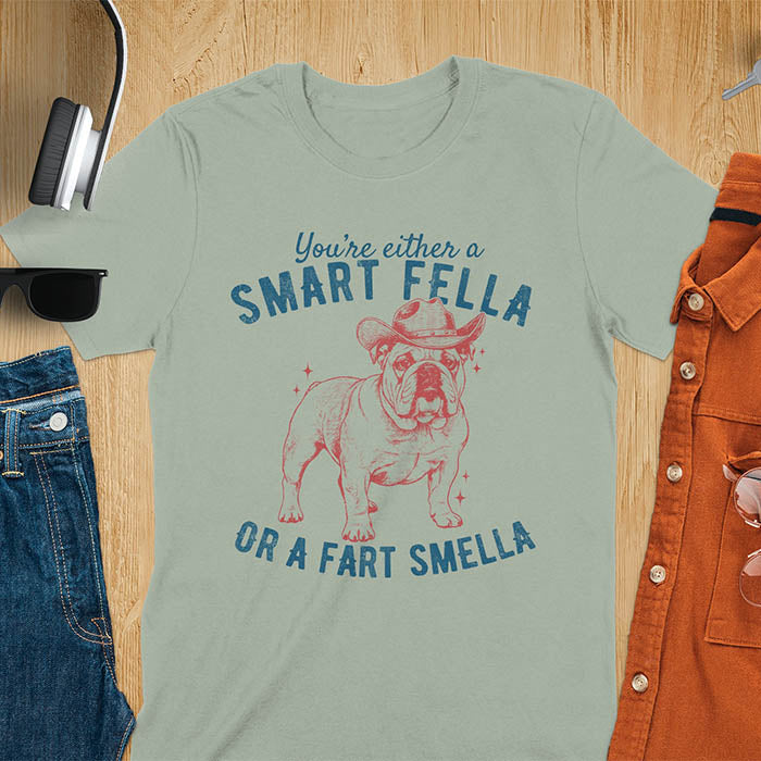 Smart Fella or Fart Smella vintage 90s meme t-shirt with English bulldog wearing cowboy hat on sage green tee