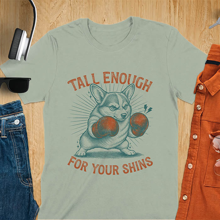 Sage Green graphic tee with retro illustration of a corgi wearing boxing gloves, text reads Tall Enough For Your Shins