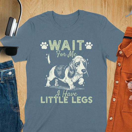 Basset hound meme t-shirt with dog illustration and text Wait For Me I Have Little Legs with paw prints - indigo blue