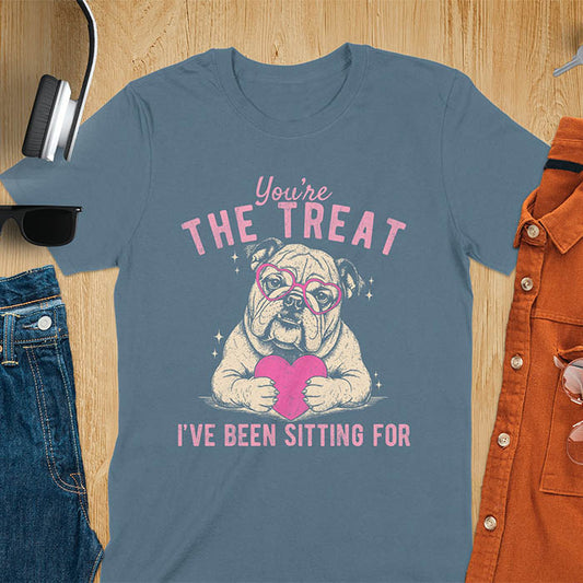 You're the treat I've been sitting for bulldog with pink heart glasses holding pink heart graphic tee on indigo blue shirt
