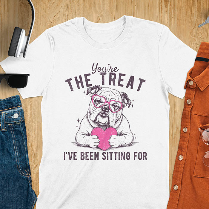 You're the treat I've been sitting for bulldog with pink heart glasses holding pink heart graphic tee on white shirt